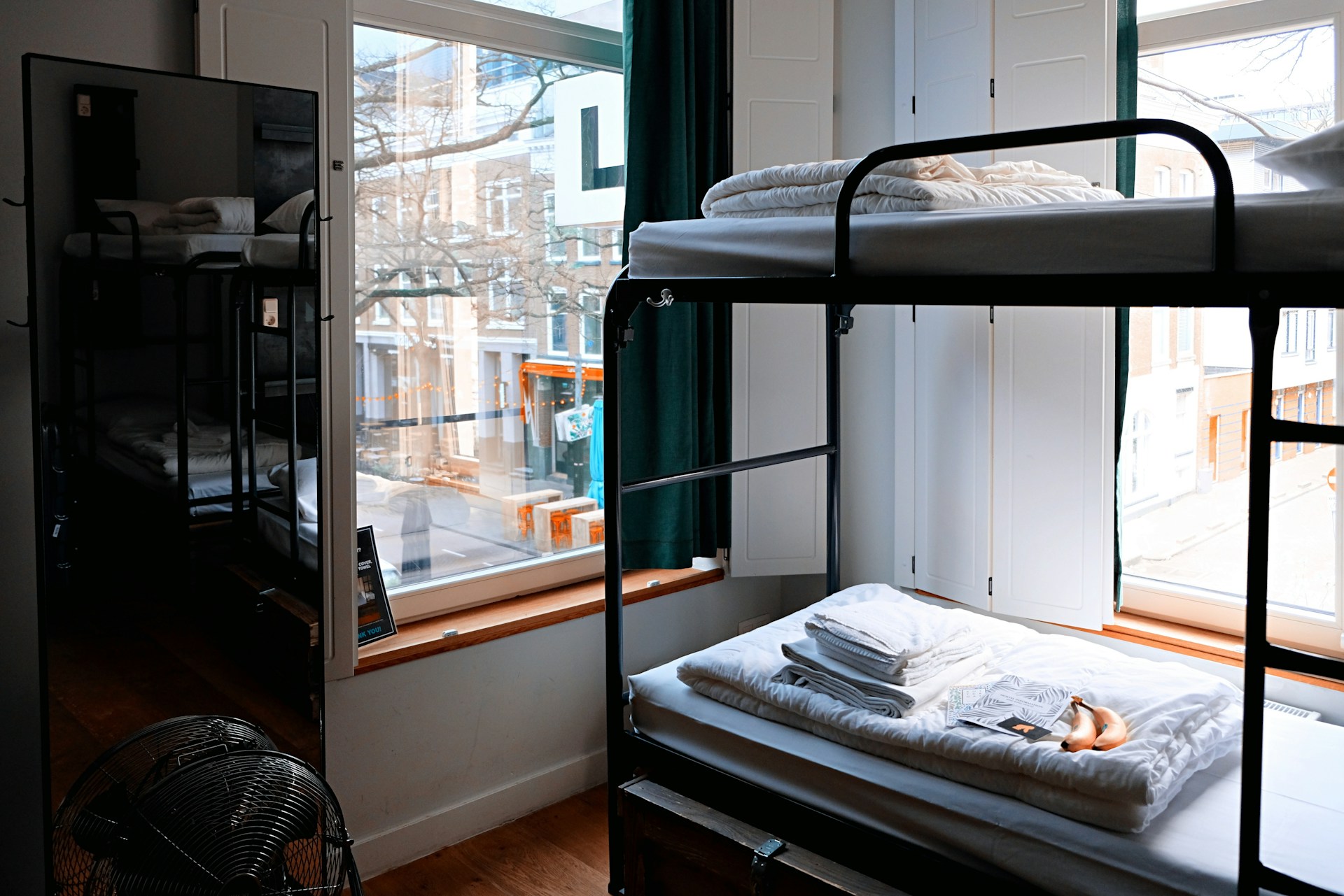 Hostel common room with travellers and bright communal seating
