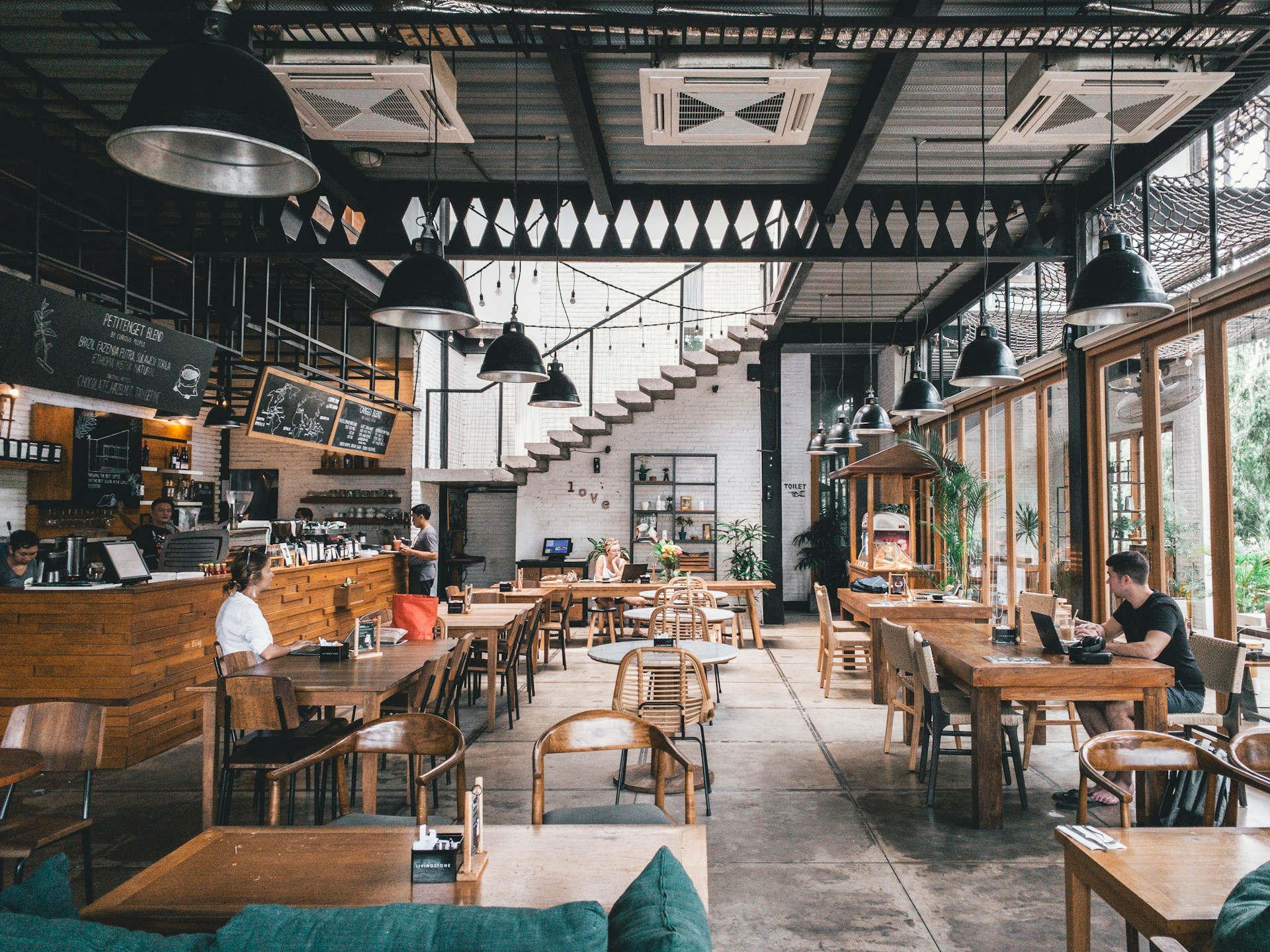 Restaurant dining room with set tables and ambient lighting